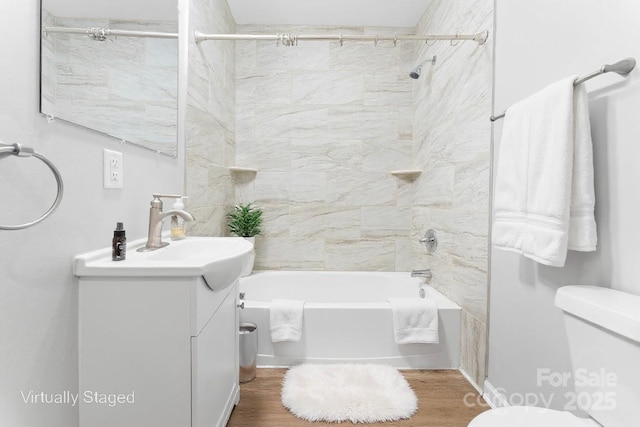 146 Georgia St SW, Concord, NC 28025 - full bath featuring vanity, washtub / shower combination, and wood finished floors