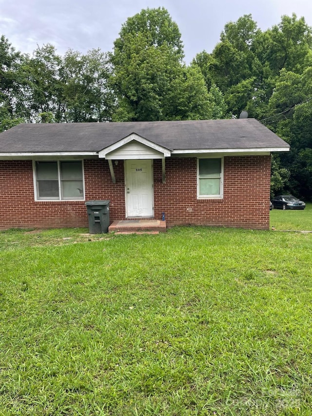505 N Secrest Ave, Monroe, NC 28110 - single story home featuring a front lawn, brick siding, and roof with shingles