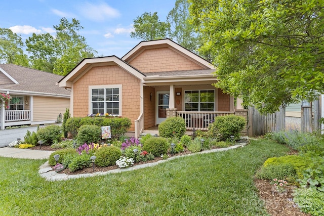 40 Avonlea Ln, Flat Rock, NC 28731 - craftsman-style house featuring covered porch and a front lawn