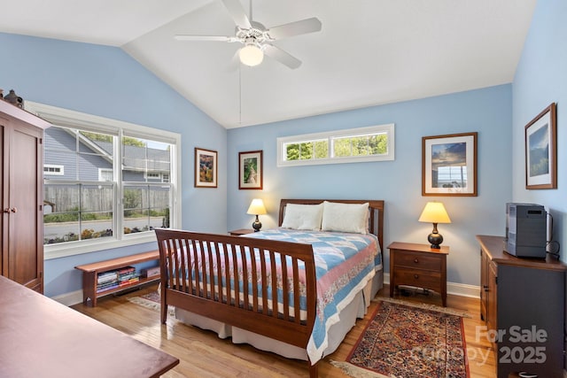 40 Avonlea Ln, Flat Rock, NC 28731 - bedroom featuring light wood-type flooring, vaulted ceiling, baseboards, and ceiling fan