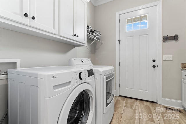 9125 Dylan Ridge Ct, Concord, NC 28027 - laundry room featuring cabinet space, separate washer and dryer, and baseboards