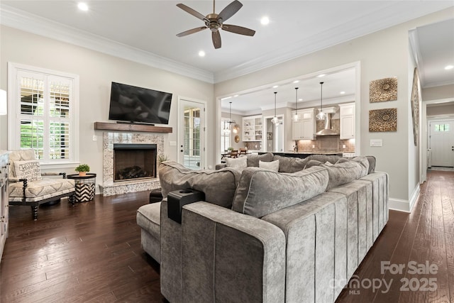 9125 Dylan Ridge Ct, Concord, NC 28027 - living area featuring ceiling fan, dark wood finished floors, recessed lighting, healthy amount of natural light, and a fireplace with raised hearth