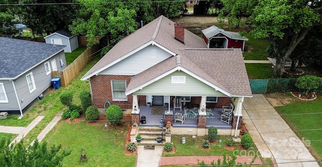 224 E Steele St, Salisbury, NC 28144 - view of front of property with brick siding, roof with shingles, a porch, and driveway