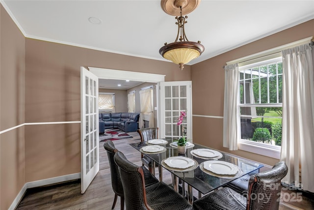 224 E Steele St, Salisbury, NC 28144 - dining space with french doors, crown molding, wood finished floors, and baseboards