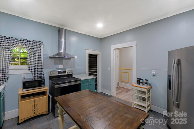 224 E Steele St, Salisbury, NC 28144 - kitchen featuring appliances with stainless steel finishes, wall chimney exhaust hood, light countertops, baseboards, and ornamental molding