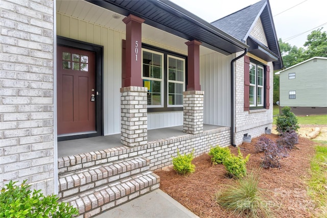 501 Old Speedway Dr NW Unit 1, Concord, NC 28027 - entrance to property featuring a porch, brick siding, roof with shingles, and crawl space