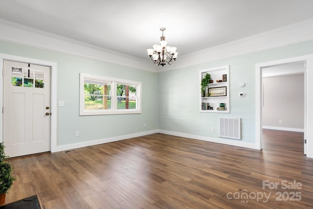 73 20th Ave SW, Hickory, NC 28602 - foyer entrance with a chandelier, baseboards, ornamental molding, and wood finished floors