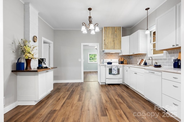 73 20th Ave SW, Hickory, NC 28602 - kitchen featuring white appliances, backsplash, under cabinet range hood, ornamental molding, and dark wood-type flooring
