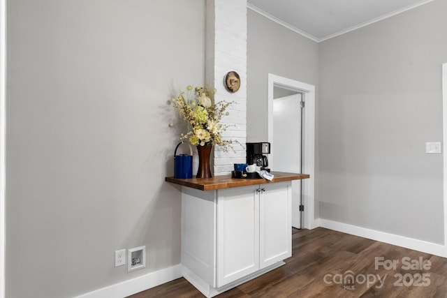 73 20th Ave SW, Hickory, NC 28602 - detailed view of baseboards, wood finished floors, and ornamental molding