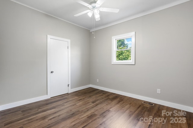 73 20th Ave SW, Hickory, NC 28602 - unfurnished room featuring dark wood-style flooring, baseboards, ceiling fan, and ornamental molding