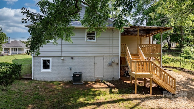 73 20th Ave SW, Hickory, NC 28602 - rear view of property with central air condition unit, stairway, brick siding, and a shingled roof