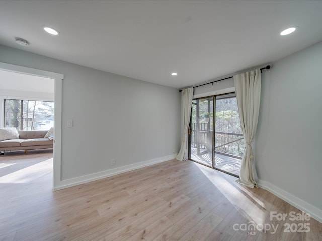 2143 Manawa Ln, Tega Cay, SC 29708 - empty room featuring a smoke detector, recessed lighting, baseboards, and light wood-style flooring