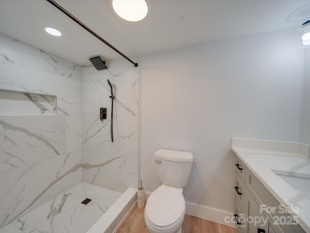 2143 Manawa Ln, Tega Cay, SC 29708 - bathroom with vanity, toilet, a marble finish shower, wood finished floors, and baseboards