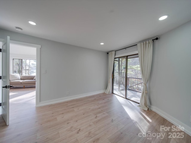 2143 Manawa Ln, Tega Cay, SC 29708 - spare room featuring recessed lighting, a smoke detector, baseboards, and light wood-style flooring