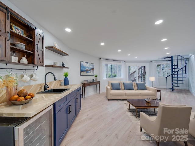 2143 Manawa Ln, Tega Cay, SC 29708 - kitchen featuring a sink, open shelves, recessed lighting, wine cooler, and light wood-style flooring