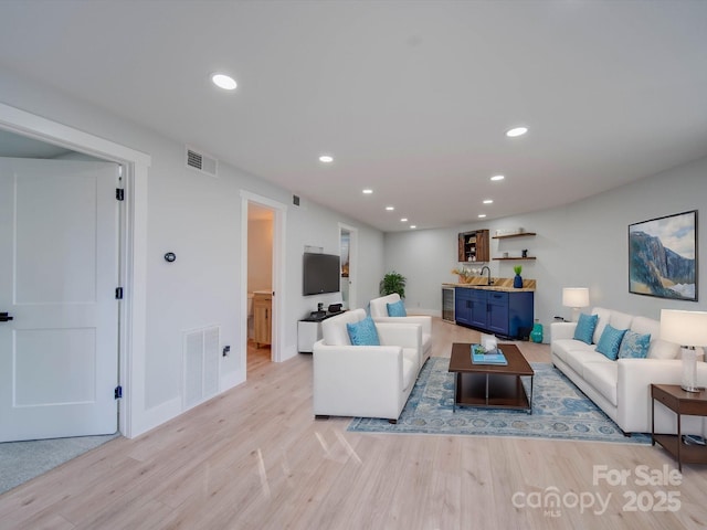 2143 Manawa Ln, Tega Cay, SC 29708 - living room featuring light wood-type flooring, recessed lighting, and baseboards