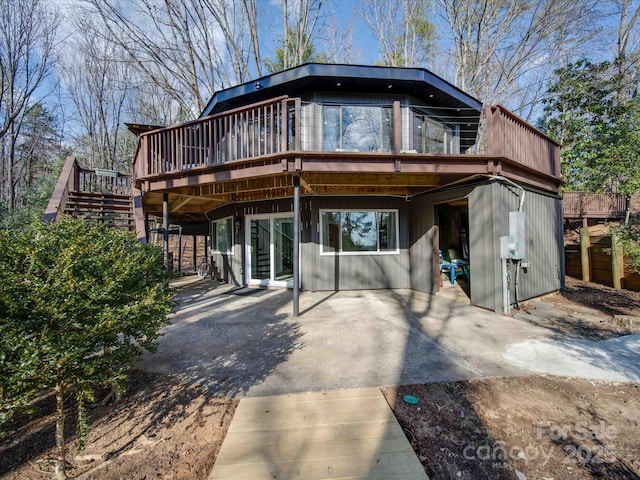 2143 Manawa Ln, Tega Cay, SC 29708 - view of front of house with a wooden deck, a patio area, and stairs