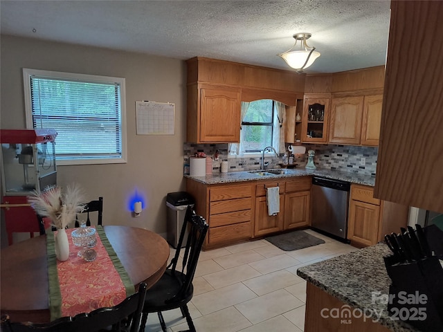 500 Bob Rollins Rd, Forest City, NC 28043 - kitchen with dishwasher, a sink, backsplash, dark stone countertops, and glass insert cabinets