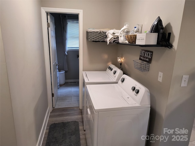 500 Bob Rollins Rd, Forest City, NC 28043 - laundry area featuring washer and dryer, baseboards, and wood finished floors