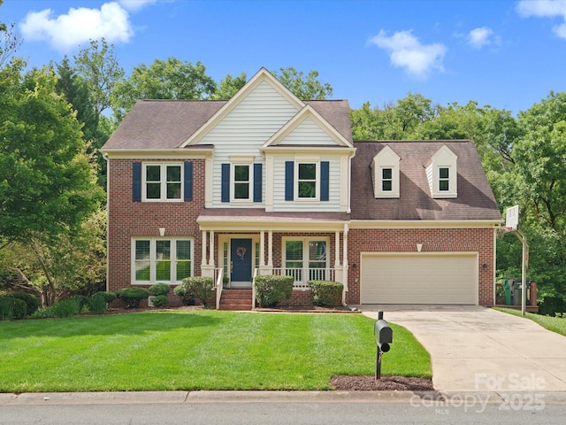 2821 Providence Spring Ln, Charlotte, NC 28270 - view of front facade with brick siding, a porch, concrete driveway, a front yard, and a garage