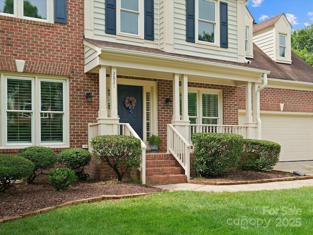 2821 Providence Spring Ln, Charlotte, NC 28270 - view of front of home with brick siding, covered porch, roof with shingles, and driveway