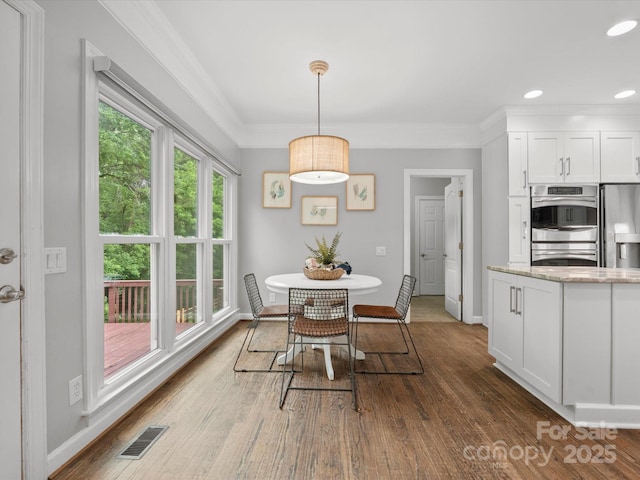 2821 Providence Spring Ln, Charlotte, NC 28270 - dining room with wood finished floors, baseboards, crown molding, and recessed lighting