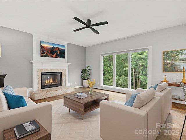 2821 Providence Spring Ln, Charlotte, NC 28270 - living room featuring ceiling fan and a fireplace