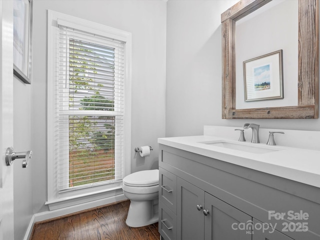 2821 Providence Spring Ln, Charlotte, NC 28270 - half bathroom featuring vanity, toilet, baseboards, and wood finished floors