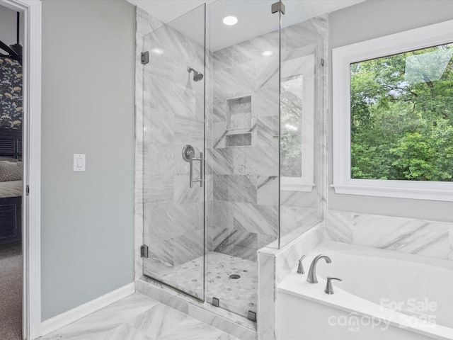 2821 Providence Spring Ln, Charlotte, NC 28270 - full bath with plenty of natural light, a garden tub, a marble finish shower, and baseboards
