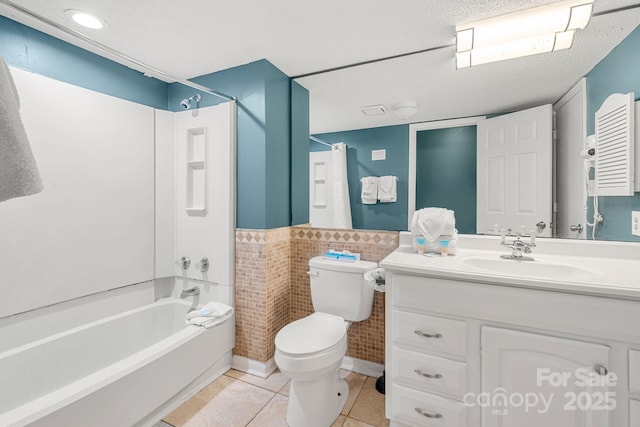 9550 Shore Dr Unit 930, Myrtle Beach, SC 29572 - full bath featuring bathing tub / shower combination, vanity, toilet, tile patterned floors, and wainscoting