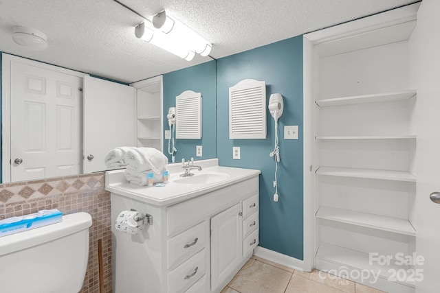 9550 Shore Dr Unit 930, Myrtle Beach, SC 29572 - bathroom featuring vanity, tile patterned floors, a textured ceiling, and toilet