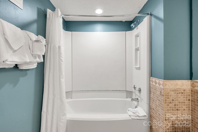 9550 Shore Dr Unit 930, Myrtle Beach, SC 29572 - full bathroom with shower / bathtub combination with curtain and a textured ceiling