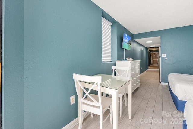 9550 Shore Dr Unit 930, Myrtle Beach, SC 29572 - interior space featuring light wood-type flooring, a textured wall, and baseboards