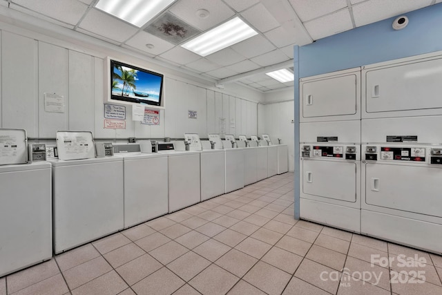 9550 Shore Dr Unit 930, Myrtle Beach, SC 29572 - community laundry room featuring washing machine and clothes dryer, stacked washer and clothes dryer, and light tile patterned floors