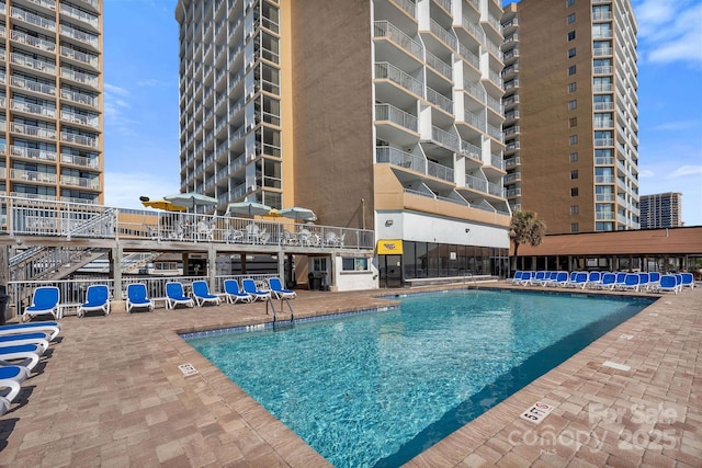 9550 Shore Dr Unit 930, Myrtle Beach, SC 29572 - community pool featuring a patio