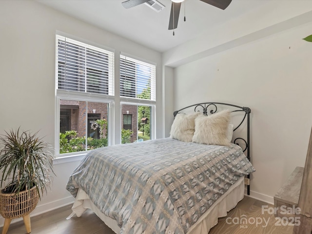 513 Cubitt Ct, Charlotte, NC 28205 - bedroom with baseboards, wood finished floors, and a ceiling fan