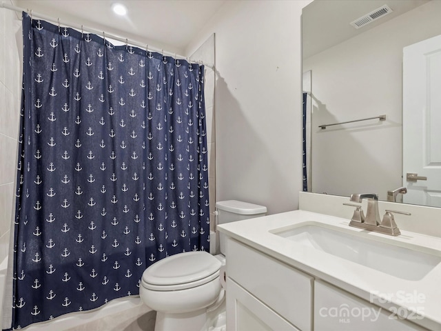 513 Cubitt Ct, Charlotte, NC 28205 - bathroom featuring toilet, vanity, and curtained shower