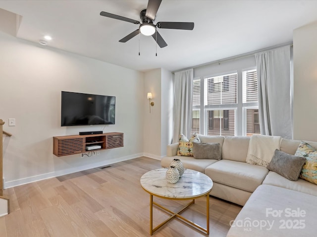 513 Cubitt Ct, Charlotte, NC 28205 - living area featuring wood finished floors, baseboards, and a ceiling fan