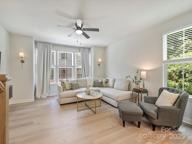 513 Cubitt Ct, Charlotte, NC 28205 - living room with healthy amount of natural light, a ceiling fan, and light wood-type flooring