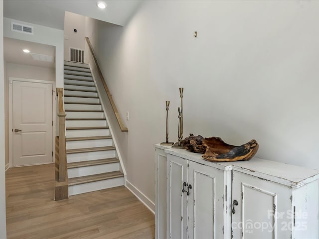 513 Cubitt Ct, Charlotte, NC 28205 - staircase featuring baseboards, wood finished floors, and recessed lighting