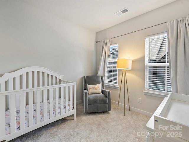 513 Cubitt Ct, Charlotte, NC 28205 - carpeted bedroom featuring a nursery area and baseboards