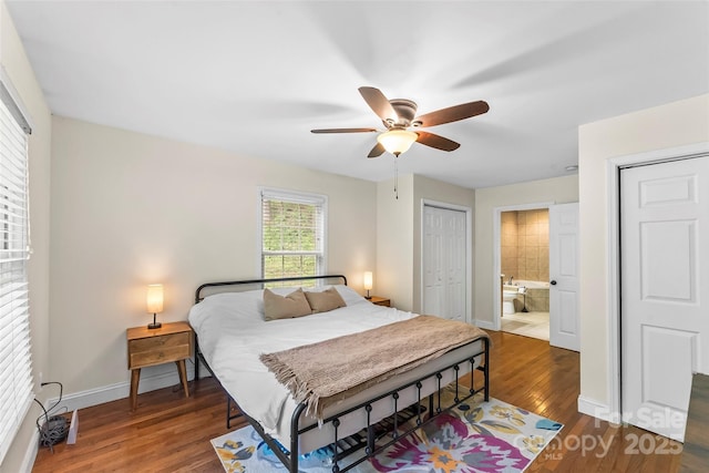 32 Evita Cove Rd, Weaverville, NC 28787 - bedroom with wood finished floors, baseboards, ceiling fan, and ensuite bath