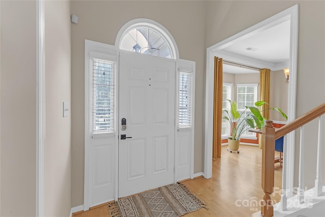 12303 Shadow Ridge Ln, Charlotte, NC 28273 - foyer entrance with light wood-style flooring, stairway, and baseboards