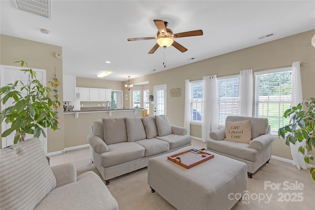 12303 Shadow Ridge Ln, Charlotte, NC 28273 - living area with baseboards, ceiling fan, plenty of natural light, light colored carpet, and recessed lighting