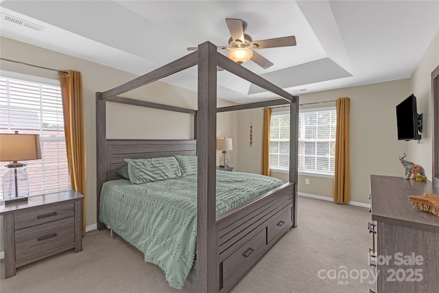 12303 Shadow Ridge Ln, Charlotte, NC 28273 - bedroom featuring light carpet, multiple windows, and baseboards