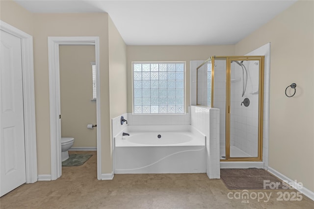 12303 Shadow Ridge Ln, Charlotte, NC 28273 - bathroom featuring a bath, a stall shower, toilet, and baseboards