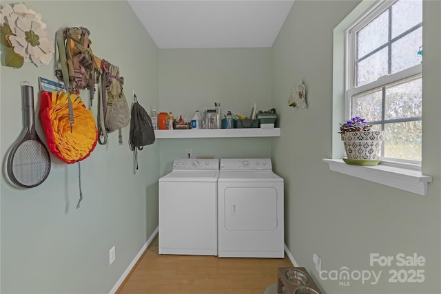 12303 Shadow Ridge Ln, Charlotte, NC 28273 - laundry area with washer and clothes dryer, wood finished floors, and baseboards