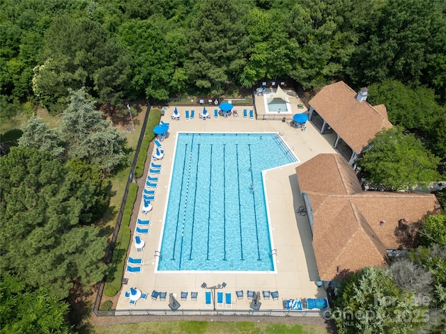 12303 Shadow Ridge Ln, Charlotte, NC 28273 - aerial view of a pool area and a heavily wooded area