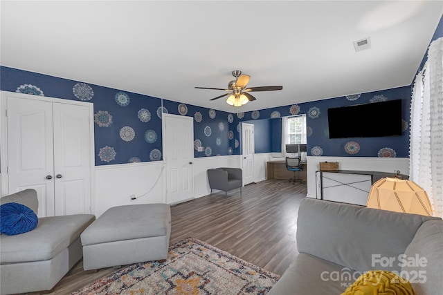 12303 Shadow Ridge Ln, Charlotte, NC 28273 - living area with wainscoting, wallpapered walls, ceiling fan, and wood finished floors