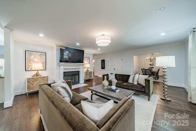 1121 S Wendover Rd, Charlotte, NC 28211 - living area featuring baseboards, crown molding, a fireplace with flush hearth, dark wood-type flooring, and recessed lighting